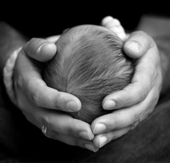 Cranial Osteopathy shown with cradling hands